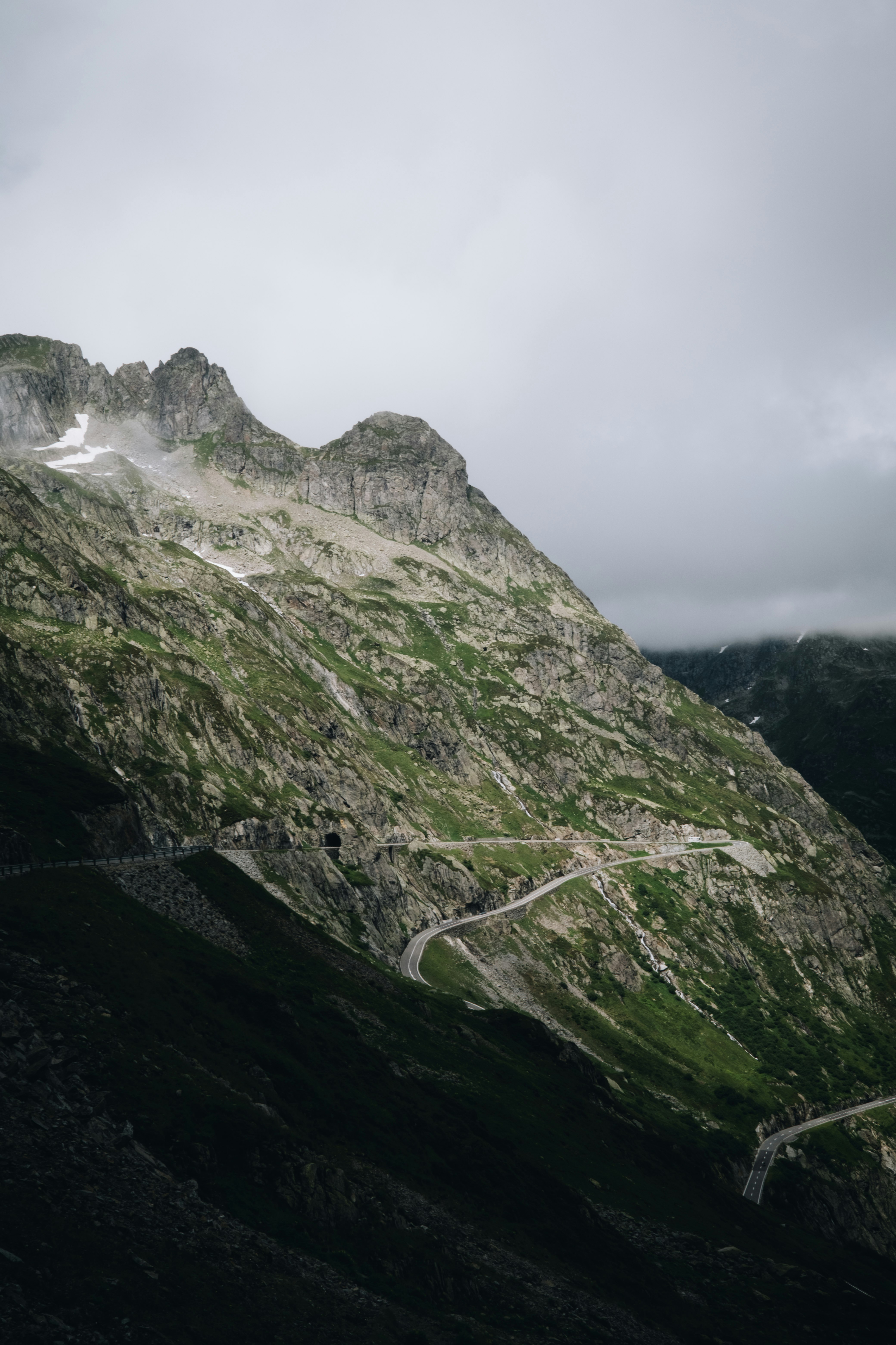 green and gray mountain under white sky during daytime